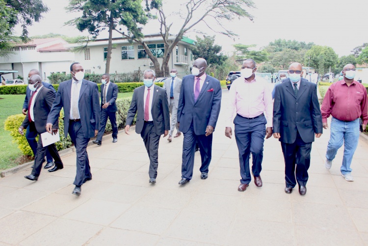 The University of Nairobi Vice Chancellor Prof. Stephen Kiama (L) welcomes Education Cabinet Secretary Prof. George Magoha at the College of Health Sciences ahead of the official launch of Center for Epidemiological Modelling and Analysis (CEMA).