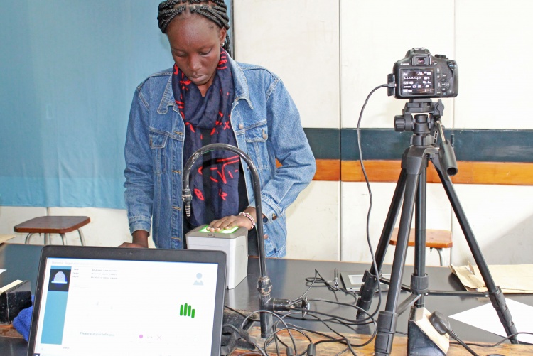 New student getting her biometrics taken