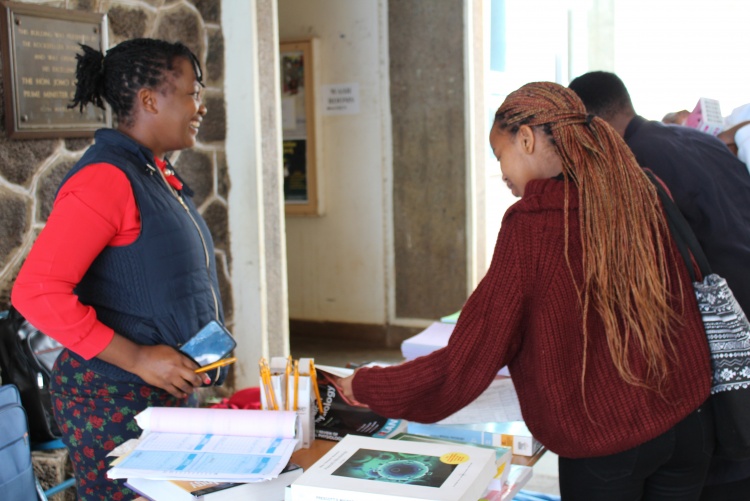 New students sampling school merchandise on sale 