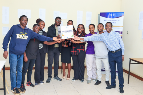 Part of the contestants, partners, and the Organizing team celebrate the launch of the Art for Peace Contest Exhibitions at the Library Area, giving the walls a mouth to speak. IPPNW-MSSR at the UoN.